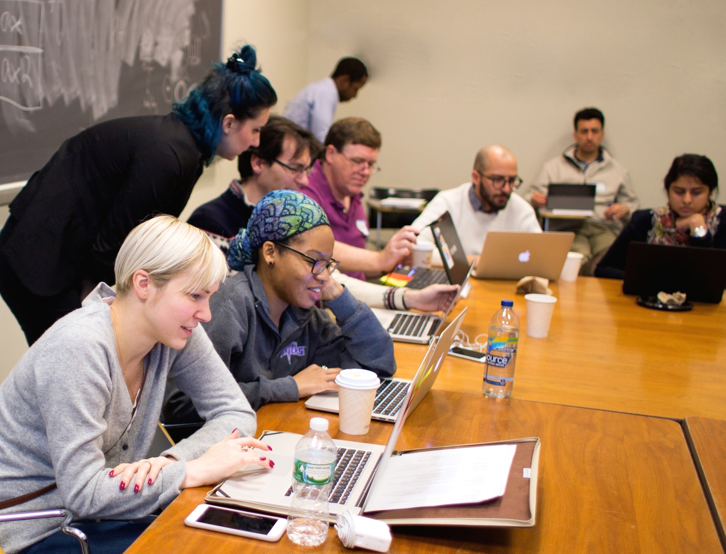 people at the first GCDRI working on laptops